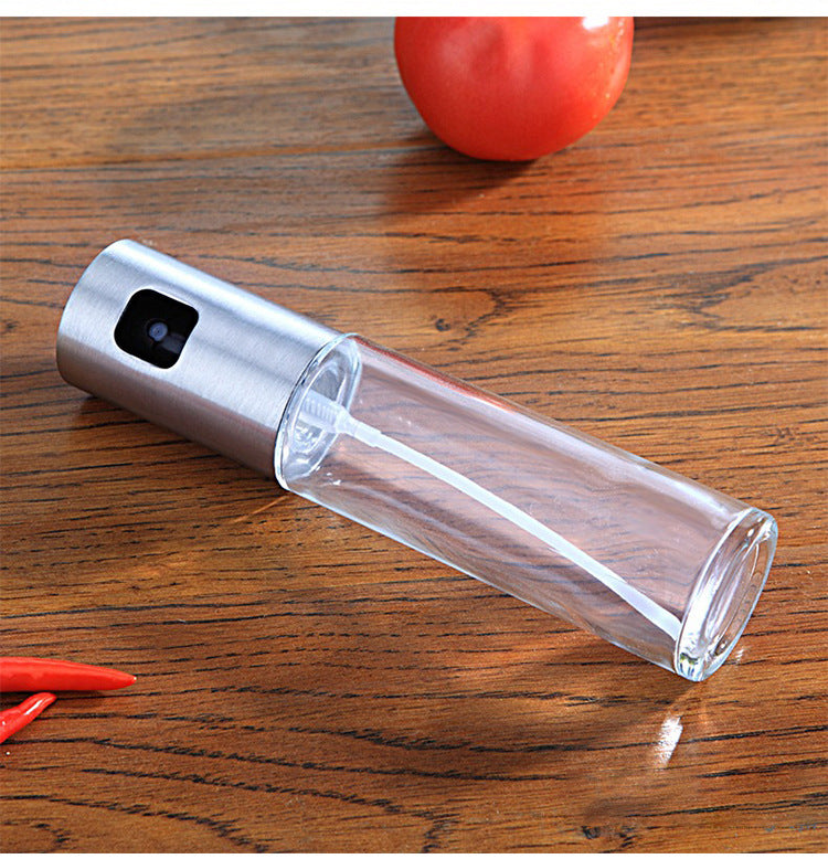 Glass oil sprayer with silver pump top