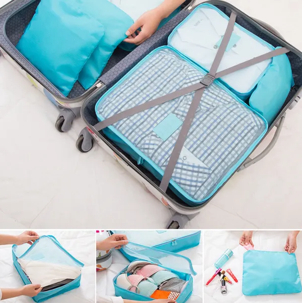 Packing cubes organizing clothes inside a suitcase