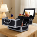 Kesho makeup train case open on a vanity with trays and mirror