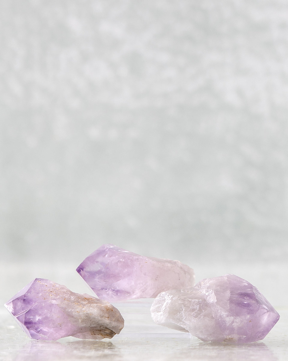 Amethyst point held in a hand